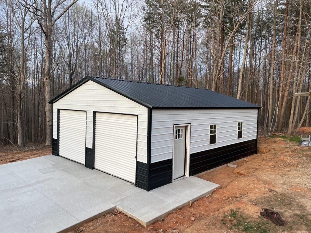 24x26x9 vertical roof steel garage with roll-up doors in North Carolina
