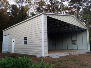 Tan metal building with an enclosed side and an open-end bay