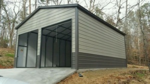 Gray two-tone metal garage with an open front