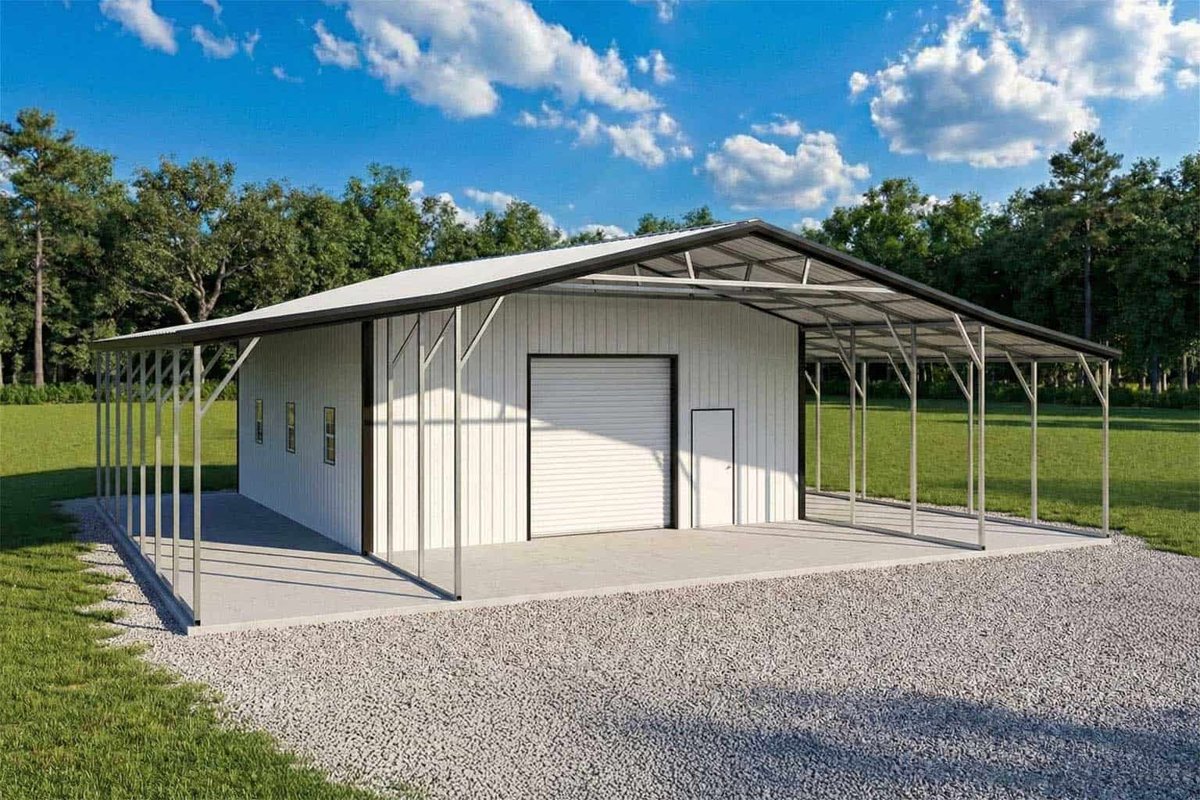 White metal garage with a roll-up door and open lean-tos on both sides