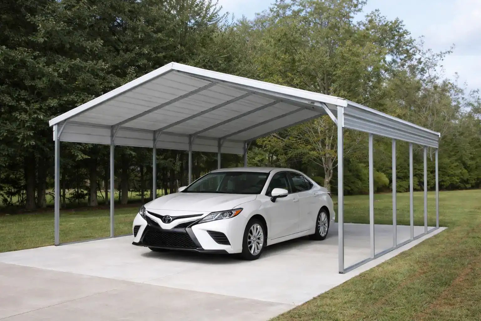 White metal carport with a vertical roof covering a car on a concrete pad